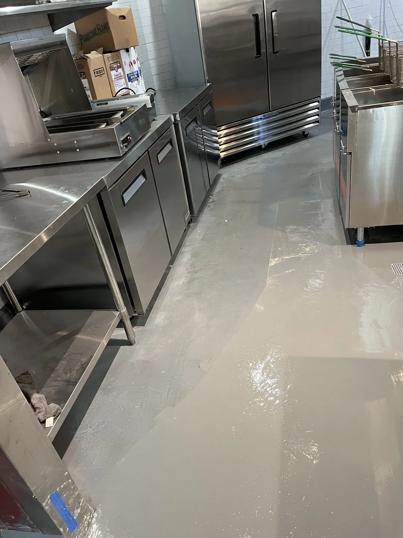Light grey epoxy floor in a commercial kitchen