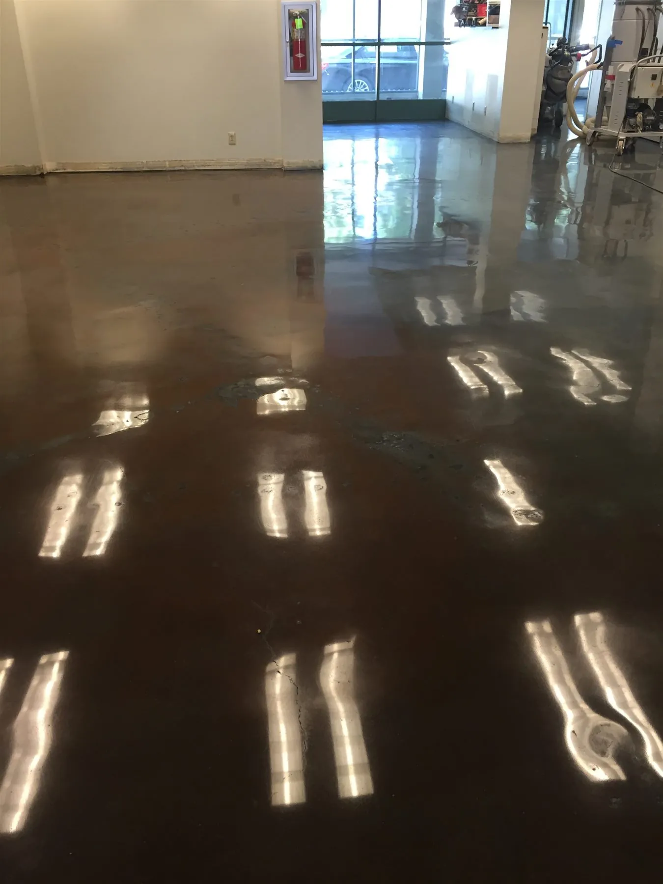 Mirror-finish polished concrete floor in a commercial space