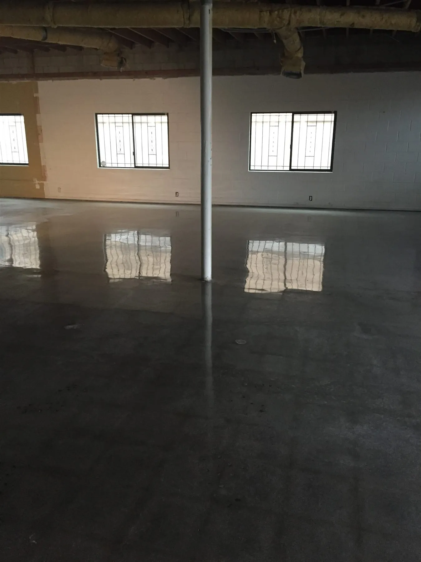 Mirror-finish polished concrete warehouse floor